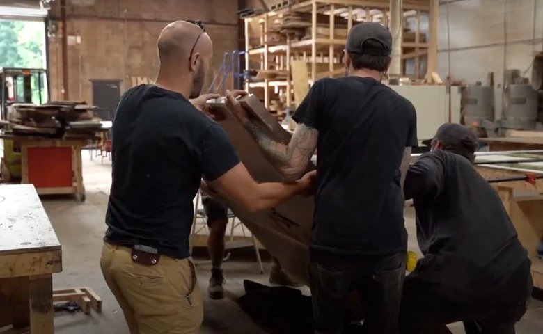 Jack and 2 men moving a 27 foot wood table