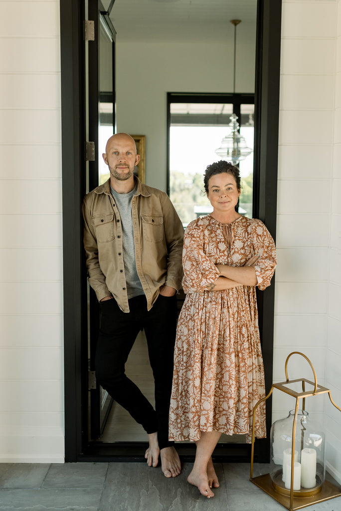 Furniture company owners Jack and Danielle stand in doorway